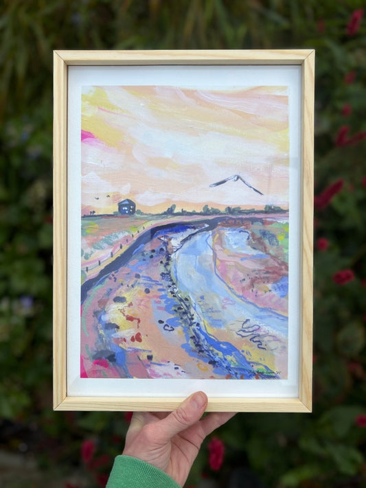 Framed watercolor painting of a landscape with a river and mountain.