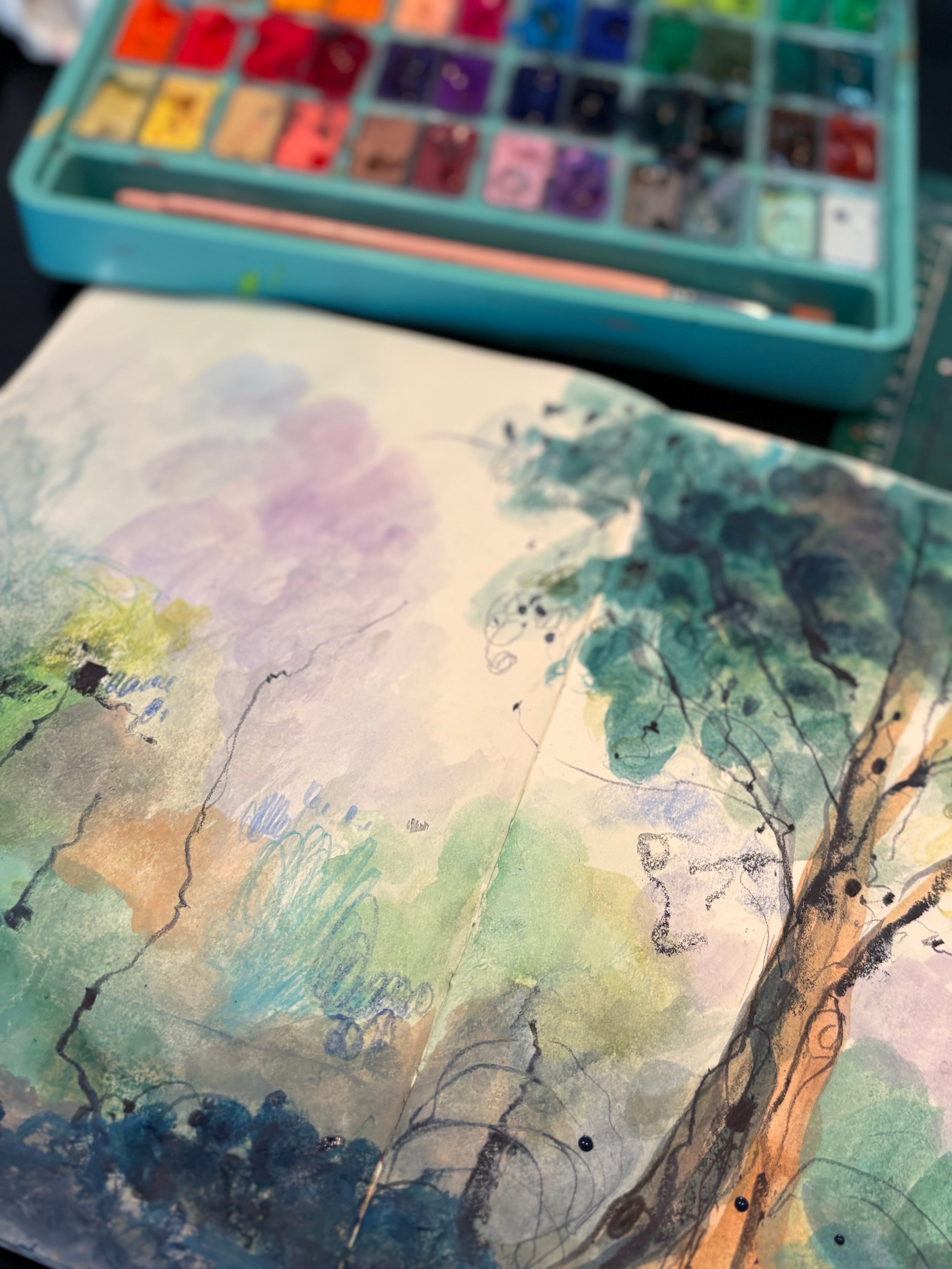 Abstract mixed media landscape  painting shown with a paint palette